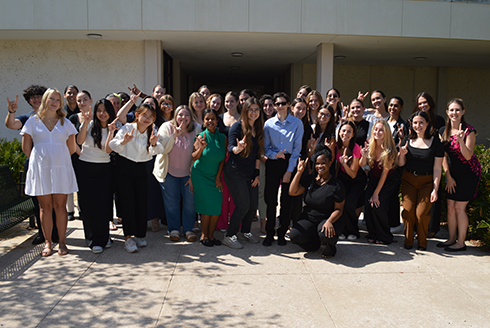 Undergraduate students in the ABA minor gather in a large group outside