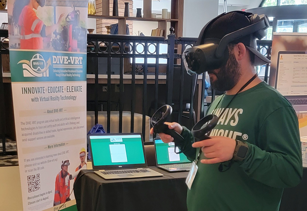 A conference attendee uses virtual reality system