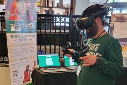 A conference attendee uses virtual reality system