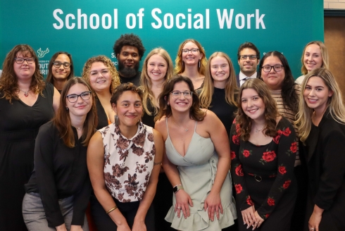 Celebrating students gather at pinning ceremony