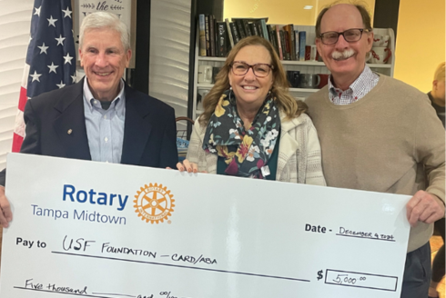 Rob Kraemer, Christine Rover, and Fred Wallrapp, president of Tampa Midtown Rotary