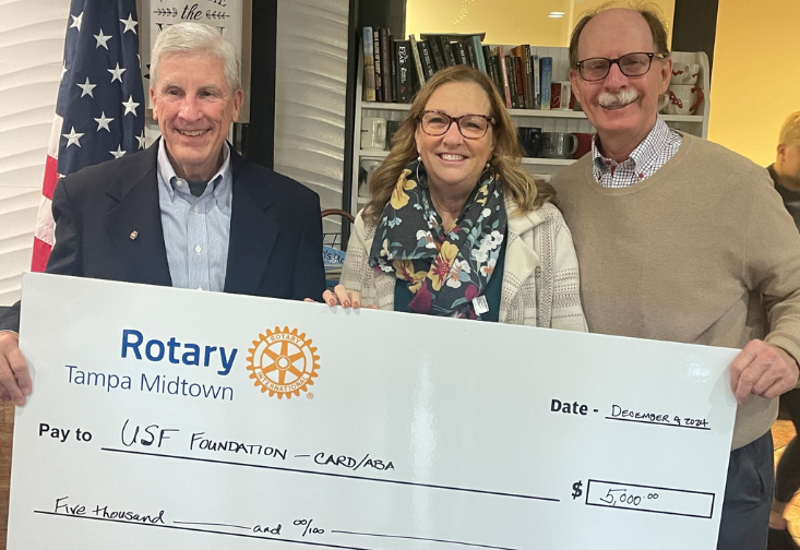 Rob Kraemer, Christine Rover, and Fred Wallrapp, president of Tampa Midtown Rotary