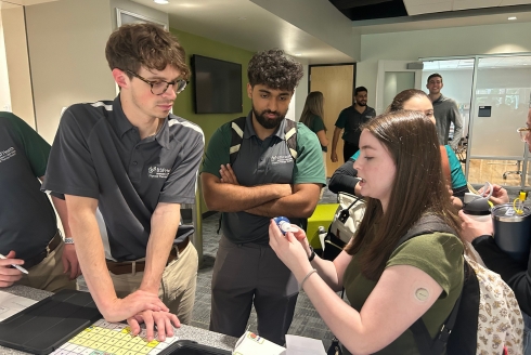 Students collaborating at the IPE event