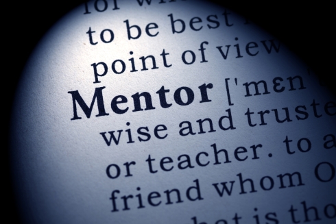 A close up of the word MENTOR in a dictionary
