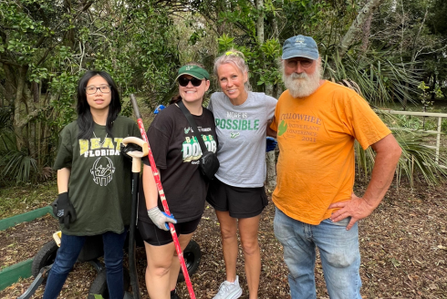 Ly Do, Jordon Wilson, Stephanie Arthur, and Craig Huegel (left to right) standing together for a group photo at the USF Botanical Gardens.