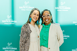 Yaritza Jefferson and Dr. Erica McCray in front of USF backdrop