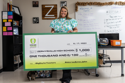 LeAnne John receives a $1,000 check for the CFP Foundation's #BigDayforTeachers.