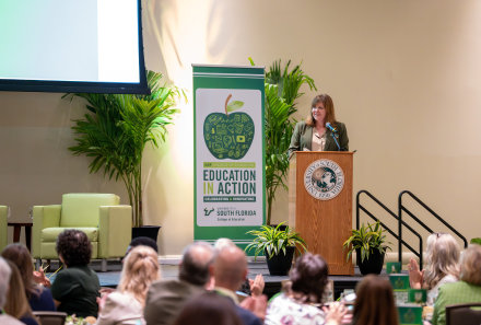 College of Education Dean Jenifer Schneider speaking at Education in Action