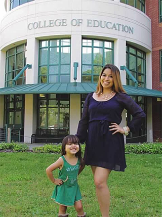 Nunez with daughter outside College of Education building