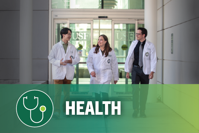 Three doctoral students walking in hallway, words at bottom health