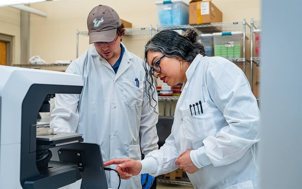 Neda Latifi, assistant professor of medical engineering, works with undergraduate student 