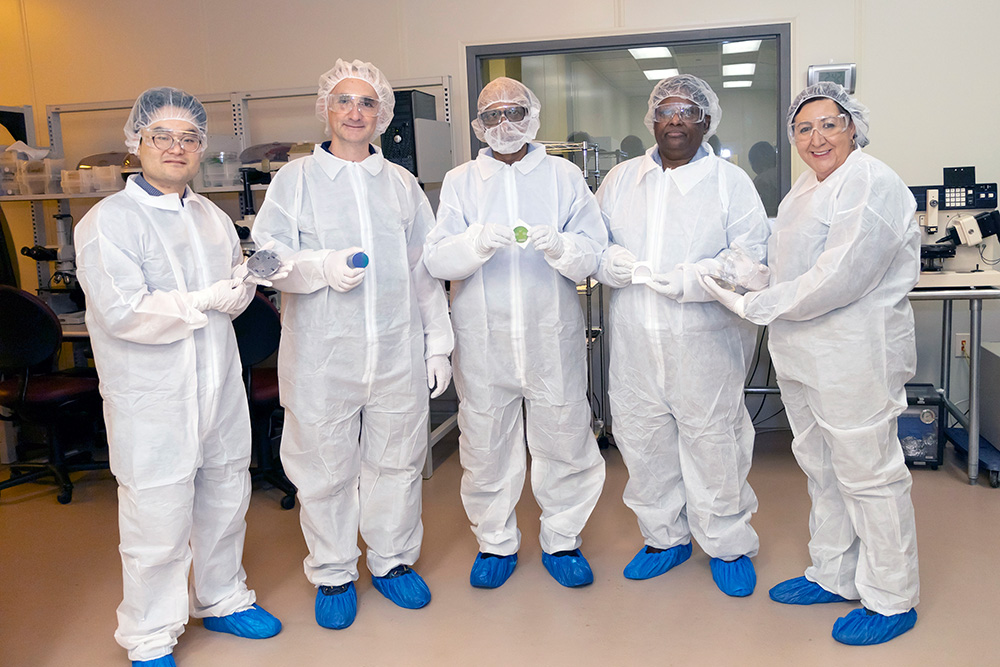 USF Engineering Professors in bunny suits in clean room lab