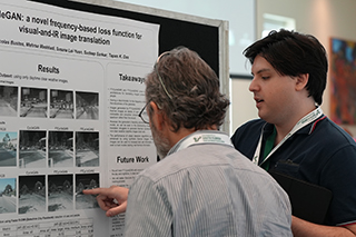 USF student explaining his research work at GNSI Tampa Summit 3