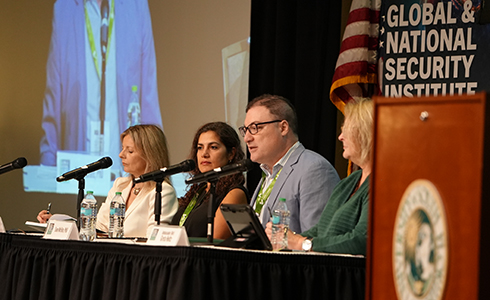 Panel discussion on stage at Tampa Summit 4