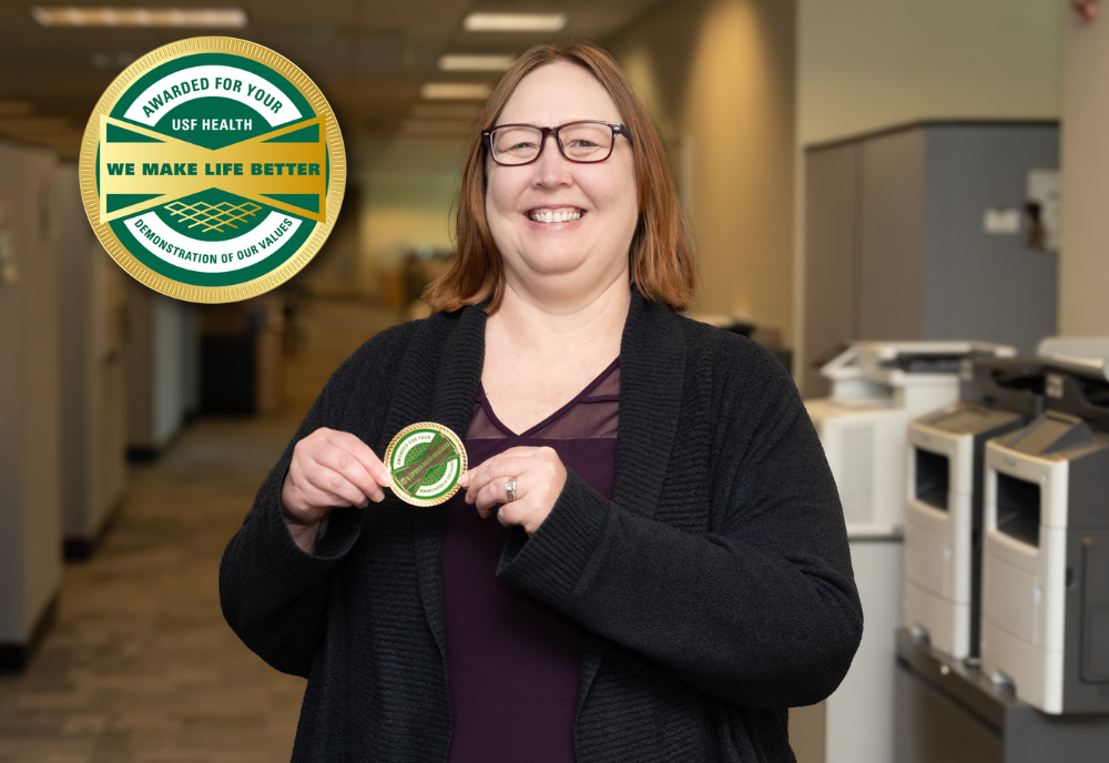 Amy Mentel with USF Health Culture Coin.