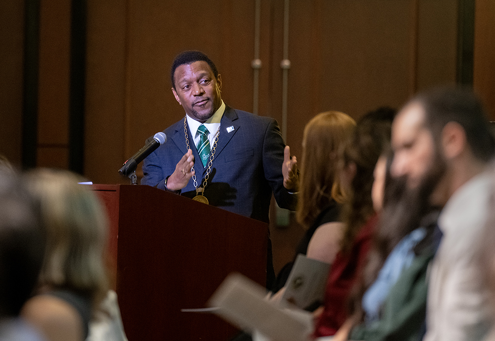 Dean Sneed speaks during the white coat ceremony