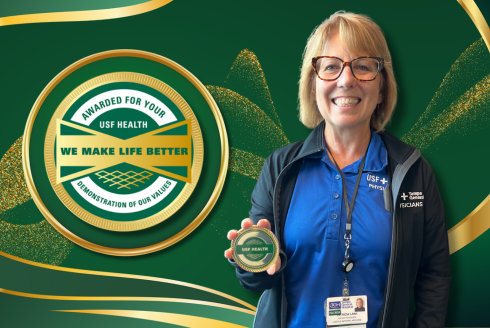 USF Health honors Patti Lane with a Culture Coin for excellence in coordinating patient care