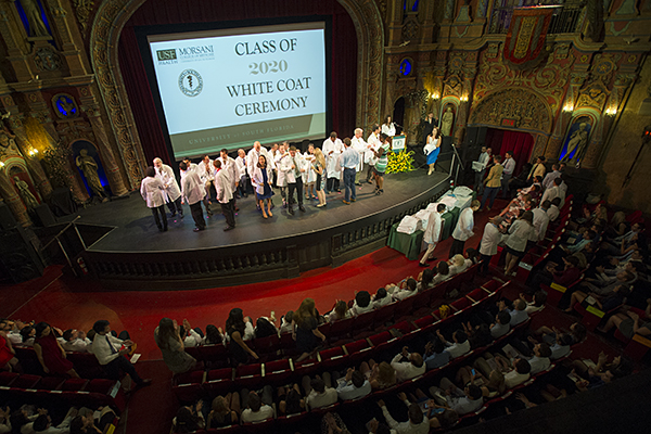 USF medical students on the stage at Tampa Theatre in 2016.