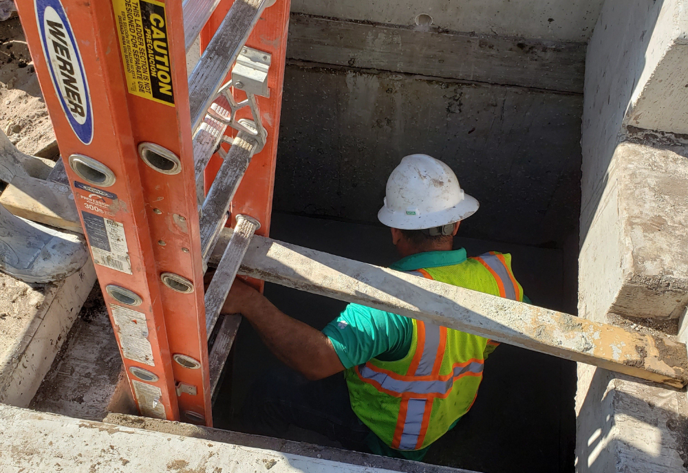 Construction worker in a Confined Space.