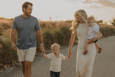 Anja Crist and her family walking on a beach