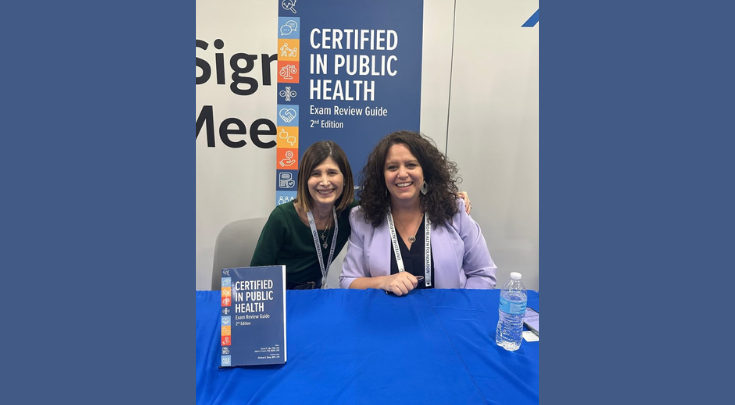 two women at a book signing