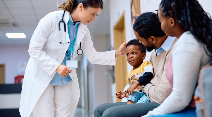 a physician meeting with a family