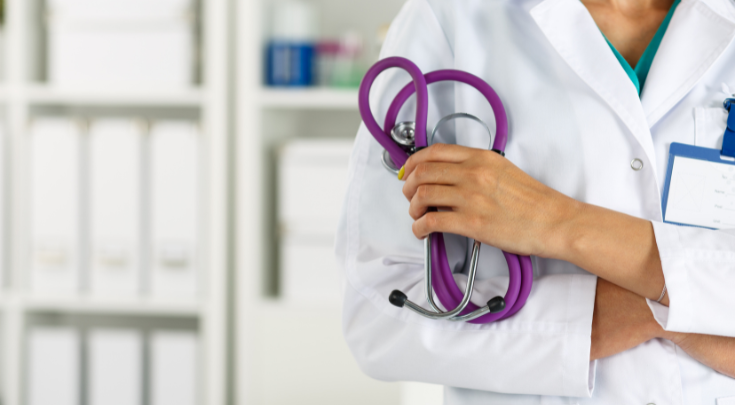 a physician holding a stethescope