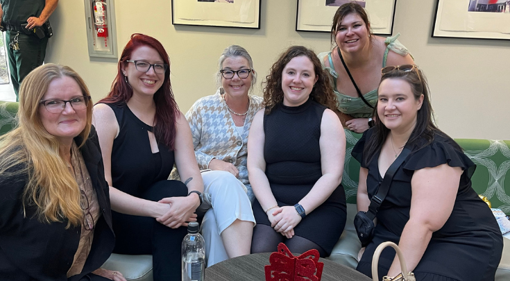 a group of women smiling