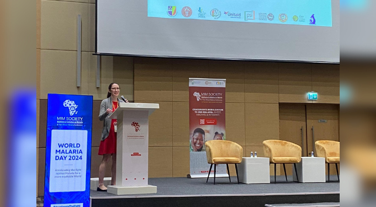 a woman speaking at a podium