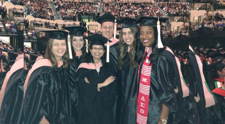 graduates smiling