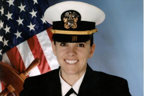 a headshot of a woman in uniform