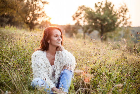 woman sitting in grass