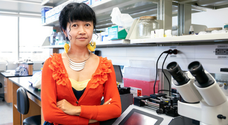 a woman with science equipment