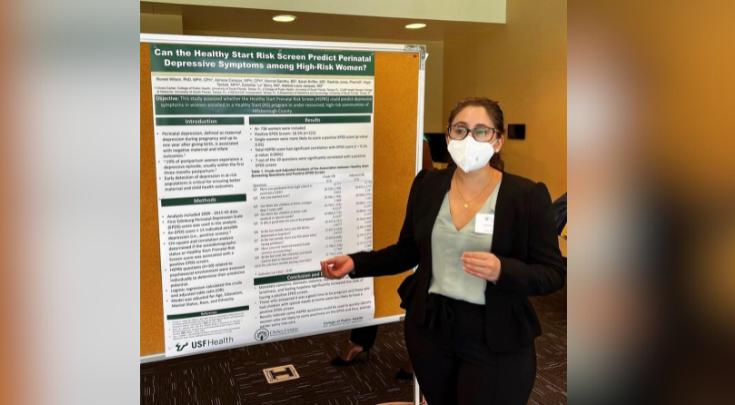 a person wearing a mask and presenting a poster