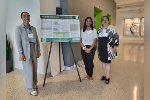 three people and a poster