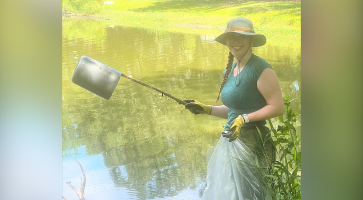 a person cleaning a pond