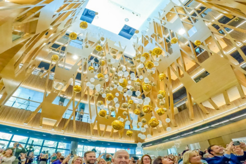 Balloons dropping inside the atrium of the Judy Genshaft Honors College building on the Tampa Campus