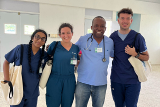 Dr. Keroll smiles with Honors College students