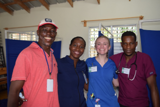 Keroll iniative doctors smile with USF student volunteer