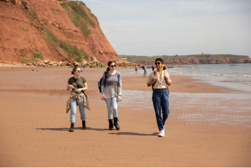 Honors Semester in Exeter students walk a beach