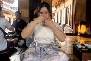 Giovana at a tea ceremony