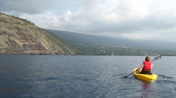 Honors student kayaks on the ocean in Hawaii