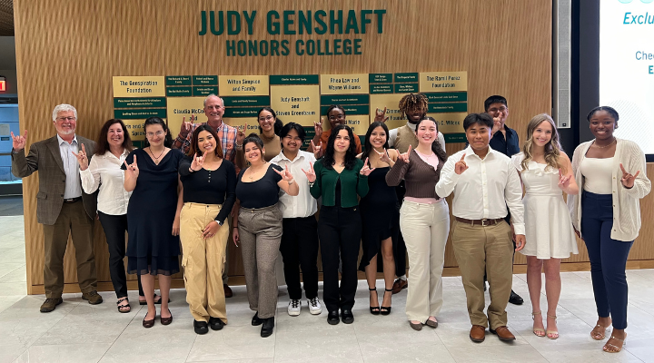 A group of USF Holcombe Scholars pose in the Judy Genshaft Honors College