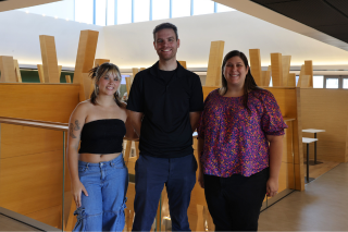 Honors student Nora Wolfgang, Honors advisor Megan Braunstein, and Dr. Matt King pose in the Judy Genshaft Honors College building.