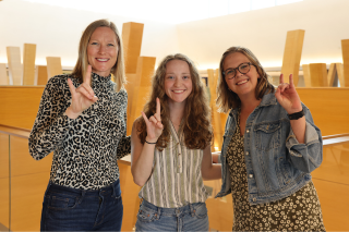 NMS Coordinator Audra Santerre, Honors student Rachel Weitz, and Honors affiliate faculty member Melanie Ryerson pose in the Honors building.