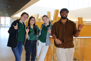 Honors Ambassadors Kinsey Roth, Nusheen Immen, Gabby Carroll, and Aakash Vijeesh pose in the Judy Genshaft Honors College