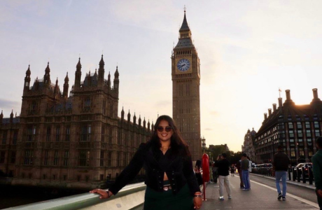 Honors student smiles in front of Big Ben in London