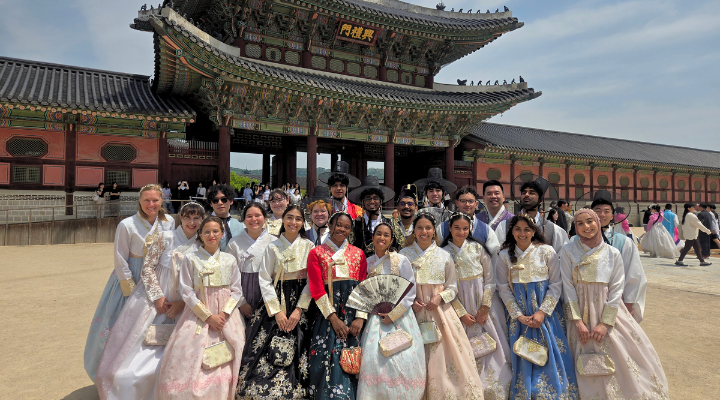 Honors students pose outside Gyeongbokgung (Palace) and Hanbok