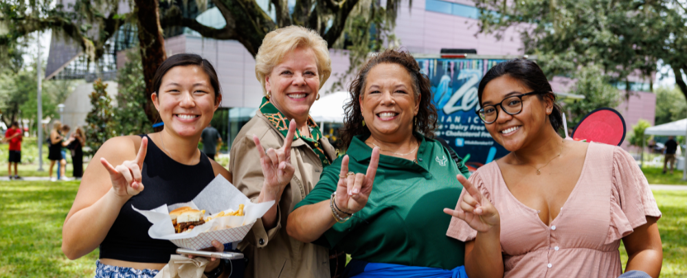 USF President Rhea Law smiles alongside students and parents