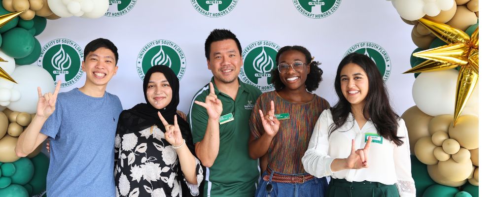 Honors alumni and current Honors students pose with Dr. Kevin Lee